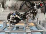 Black and silver motorcycle model on rotating holder for 1/18 1/12 scale models