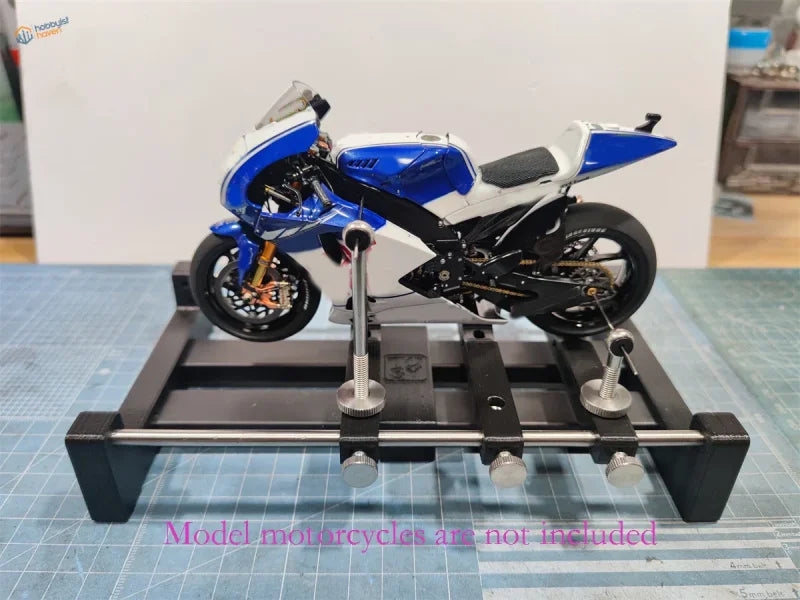 Blue and white Yamaha YZR-M1 on rotating holder for motorcycle models