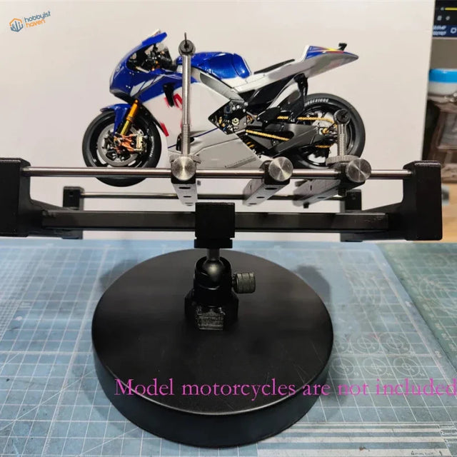 Blue and silver Yamaha racing motorcycle on rotating holder display stand