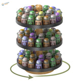 Three-tiered rotating paint bottle organizer holding assorted citadel base aradoo paint pots in various colors