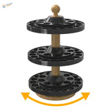 Three-tiered black plastic and wood-handled rotating paint bottle organizer with circular slots for vallejo and citadel bottles