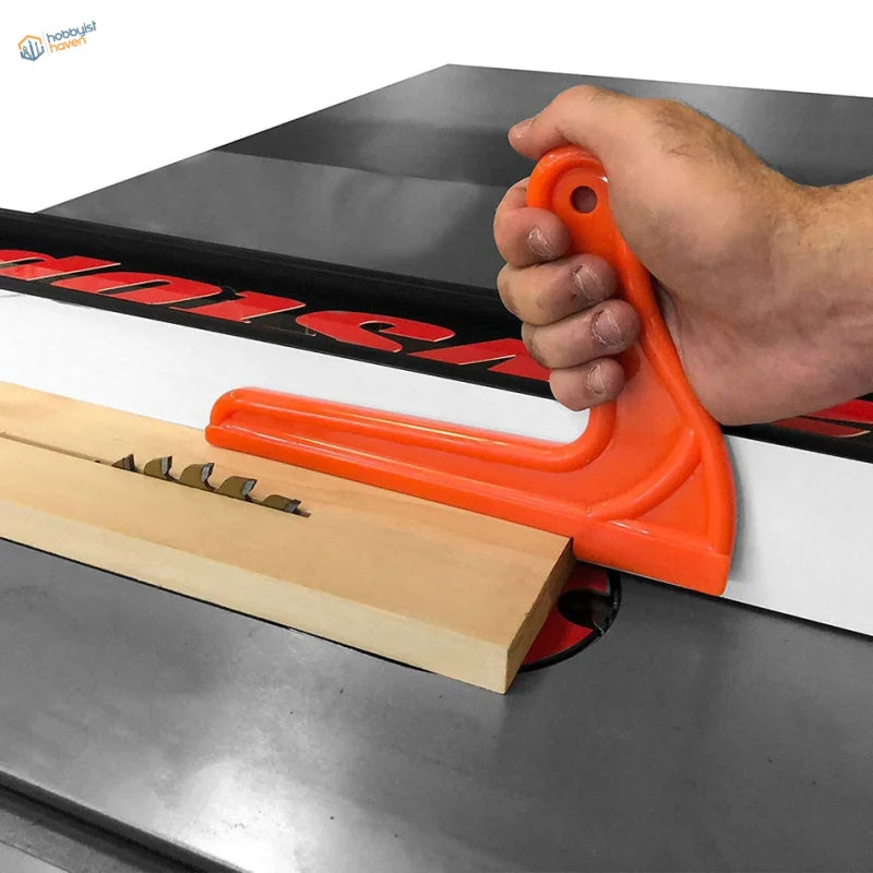 Bright orange push stick guiding wood on table saw for safety push blocks