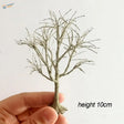 Miniature gray scale model tree with branchy textured trunk and limbs