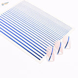 Blue stripe stickers for scale modeling on white sheet with clear acrylic nails