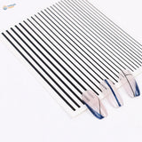 Self-adhesive black white stripe stickers on clear sheet with blue glitter nails