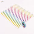 Rainbow stripe stickers on glittery blue nail with decals on white sheet