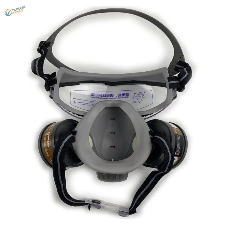 Gray and black face dust mask with cylindrical filters and safety glasses