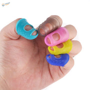 Hand holding five colorful silicone finger protectors in blue, brown, pink, yellow, dark blue