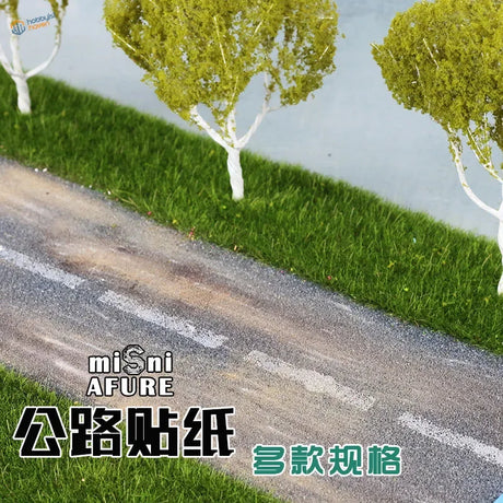 Miniature white-trunked mossy trees lining simulated asphalt stickers road