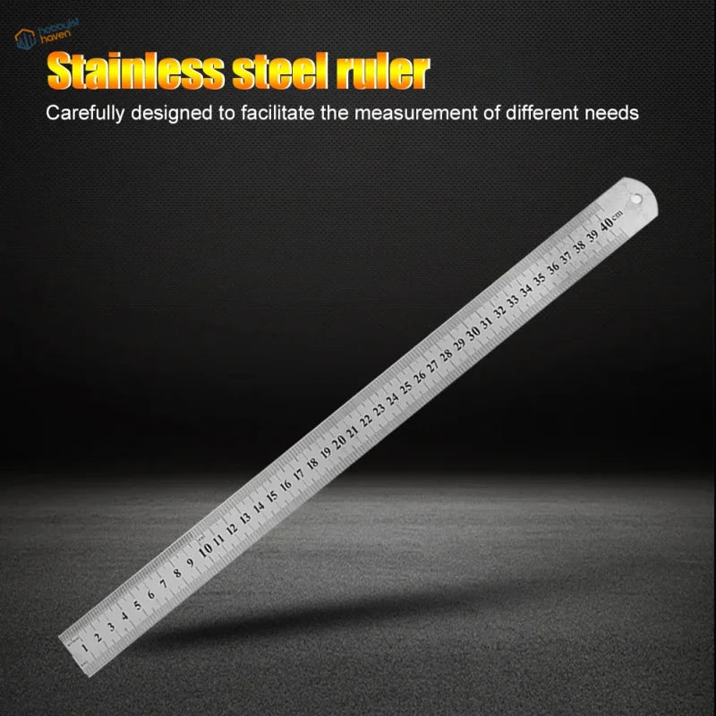 A sleek metallic stainless steel ruler with clear centimeter markings and a hanging hole for scale modeling use