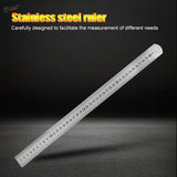 A sleek metallic stainless steel ruler with clear centimeter markings and a hanging hole for scale modeling use