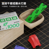 Stedi sanding sponges box with bright green steel wool pad labeled steel 1000# in wooden holder