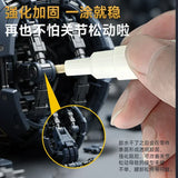 Stedi Joint Reinforcement Pen applying clear adhesive to black model kit joints
