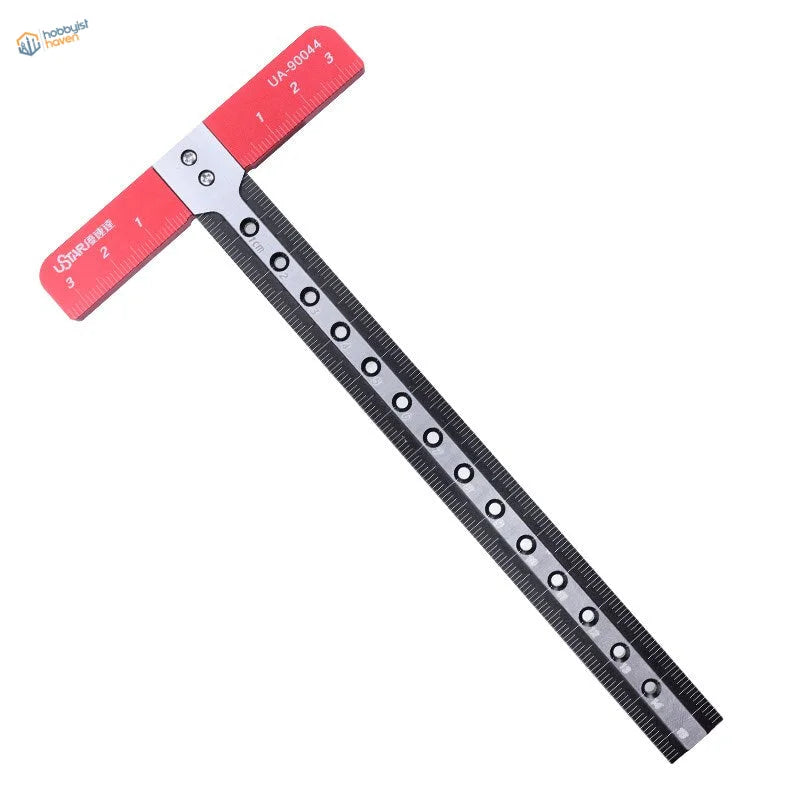 Red and black T shaped ruler pro with markings and holes