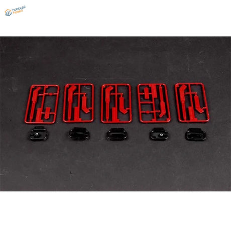Red plastic Zimmerit modelling tool parts with black connectors for German armor