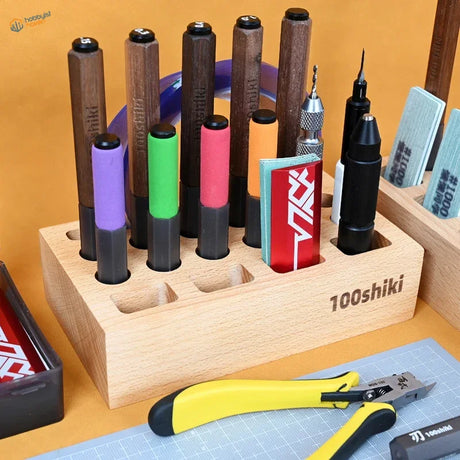Wooden 100shiki racks holding colorful scale modeling tools