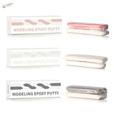 Two component epoxy putty in pink, off-white, gray packaging