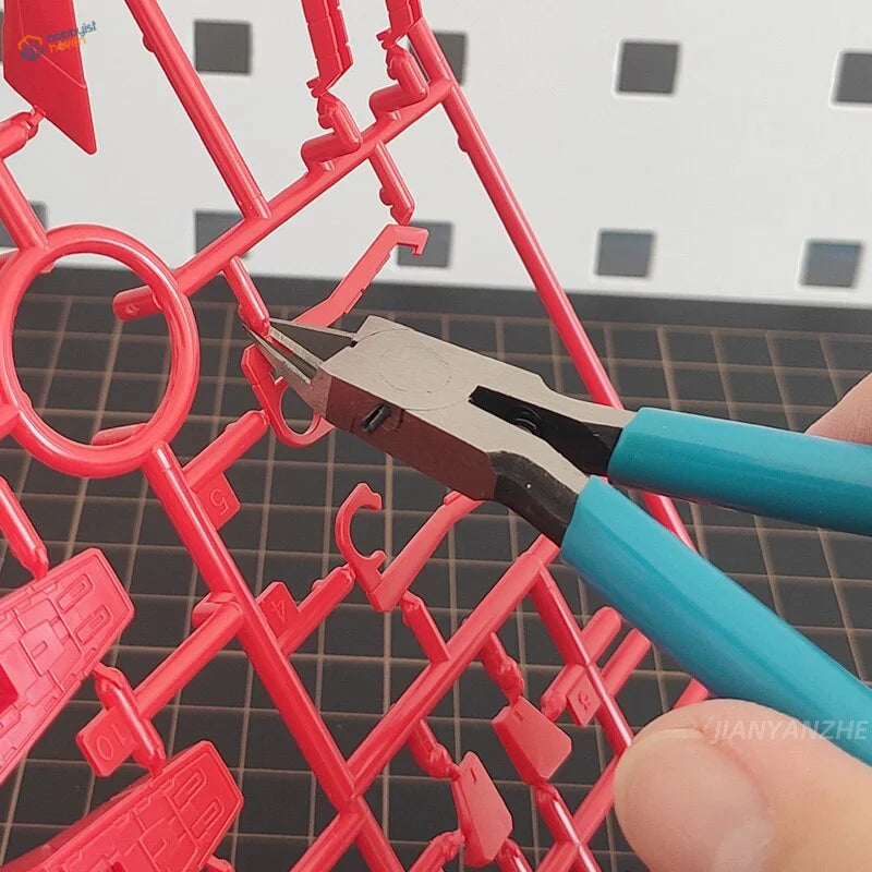 Ultra thin blade side-cutters cutting connection point on red scale modeling part
