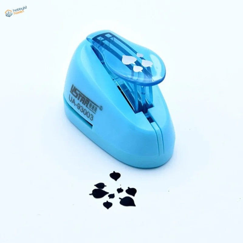 UStar tree leaf maker with light blue plastic punch and black leaves