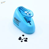 UStar tree leaf maker with light blue plastic punch and black leaves
