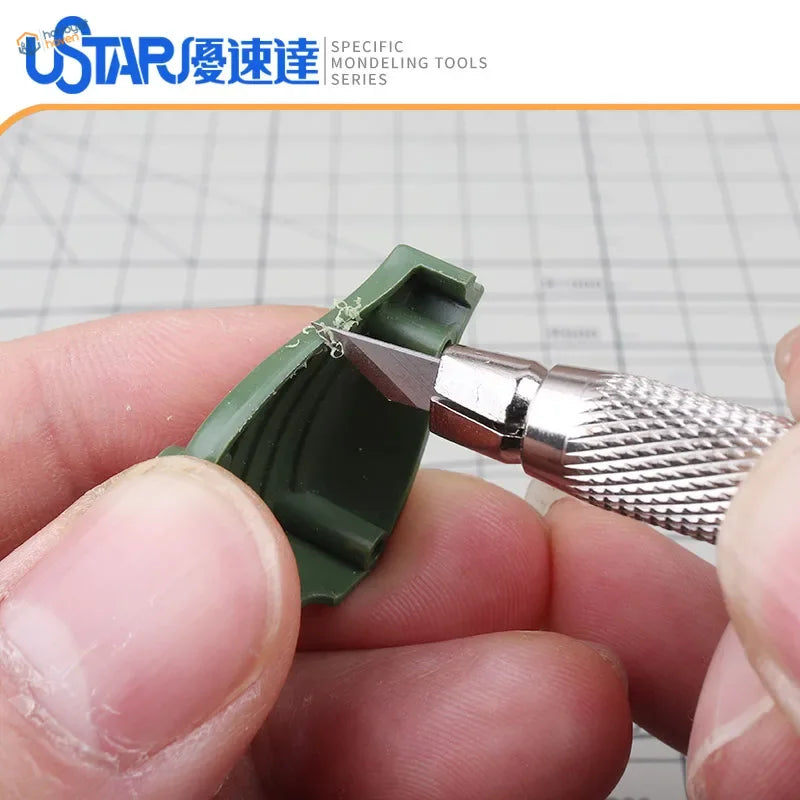 UStar precision hobby knife with 30° blades cutting green model part