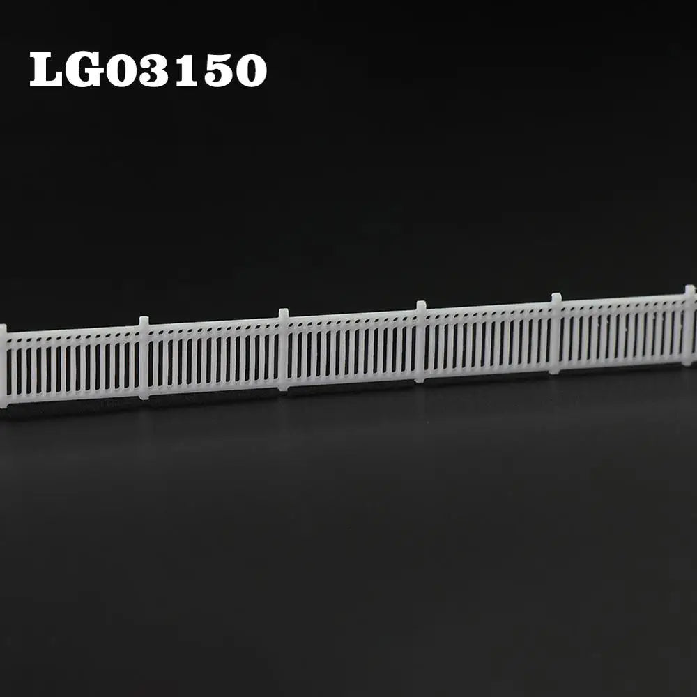 N scale white plastic model fence wall with vertical slats and posts for station platform or lattice-top picket use