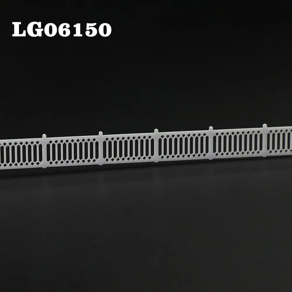 N scale white plastic model fence with lattice-top picket diamond and vertical bar pattern for station platform