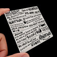 White rectangular sticker with black graffiti text for scale modeling tools