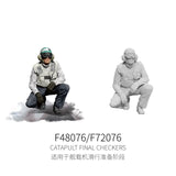 1/48 gray plastic flight deck crew member kneeling in flight gear and helmet