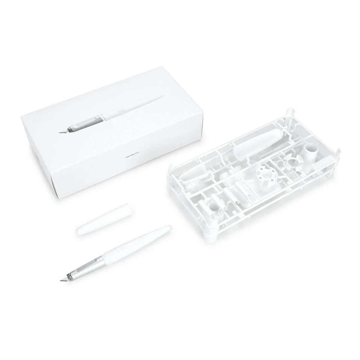 White gee hobby precision model pen knife with silver nib and translucent barrel displayed with packaging and replacement blades for scale modeling tools
