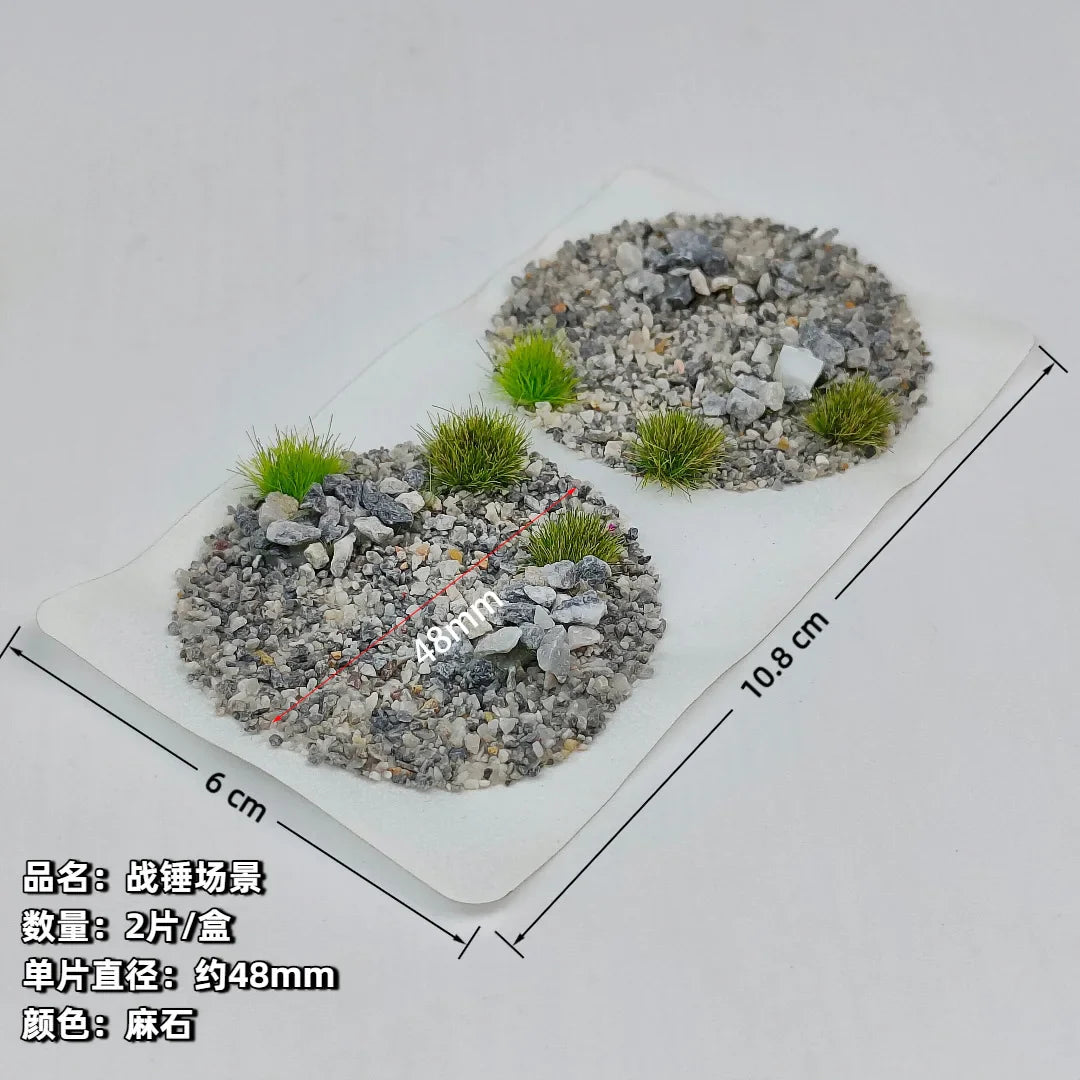 Scenic base toppers with gray gravel and green artificial grass tufts for miniature wargaming model building tools