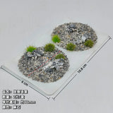 Scenic base toppers with gray gravel and green artificial grass tufts for miniature wargaming model building tools