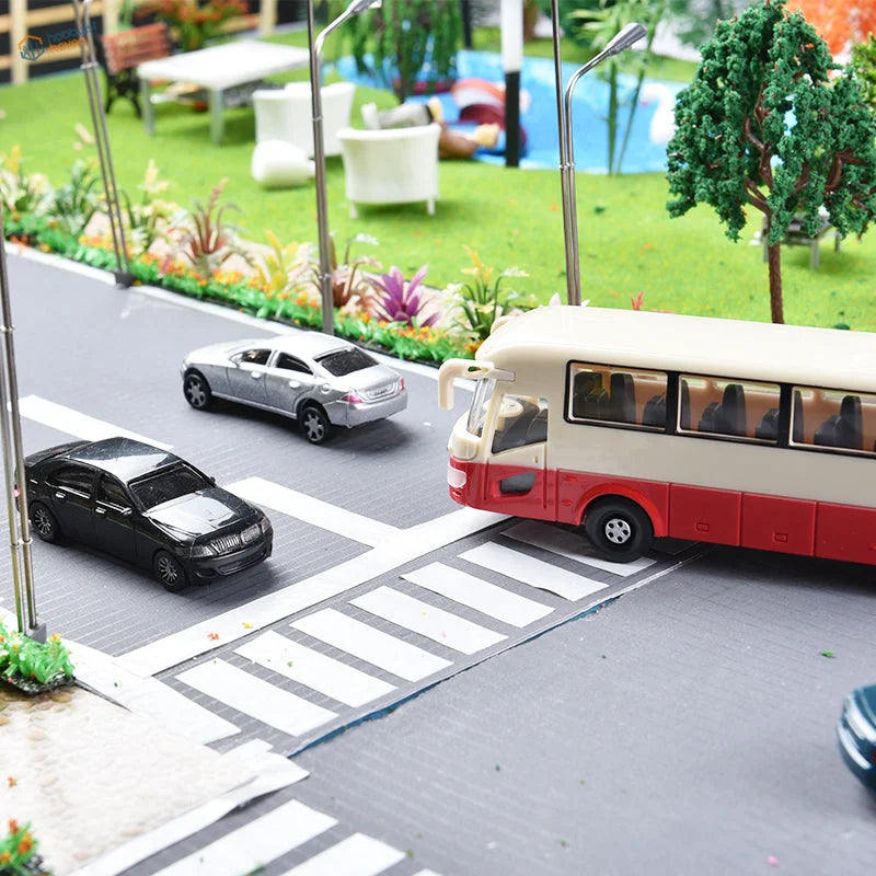 Red and cream toy bus with black seats for scale railway modeling 1:75-1:200