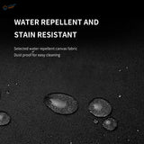 Water-resistant canvas apron with black textured fabric repelling droplets