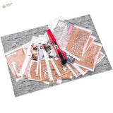 Red utility knife on Weathering Effects Stencils sheets for scale modeling tools
