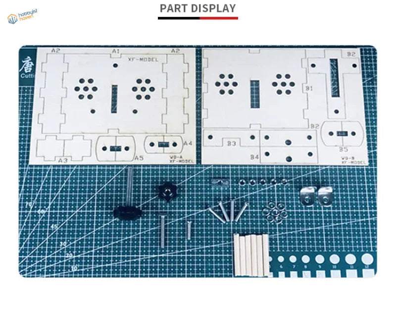 Wood bending tool parts: white plastic kit with black silver metal on blue mat